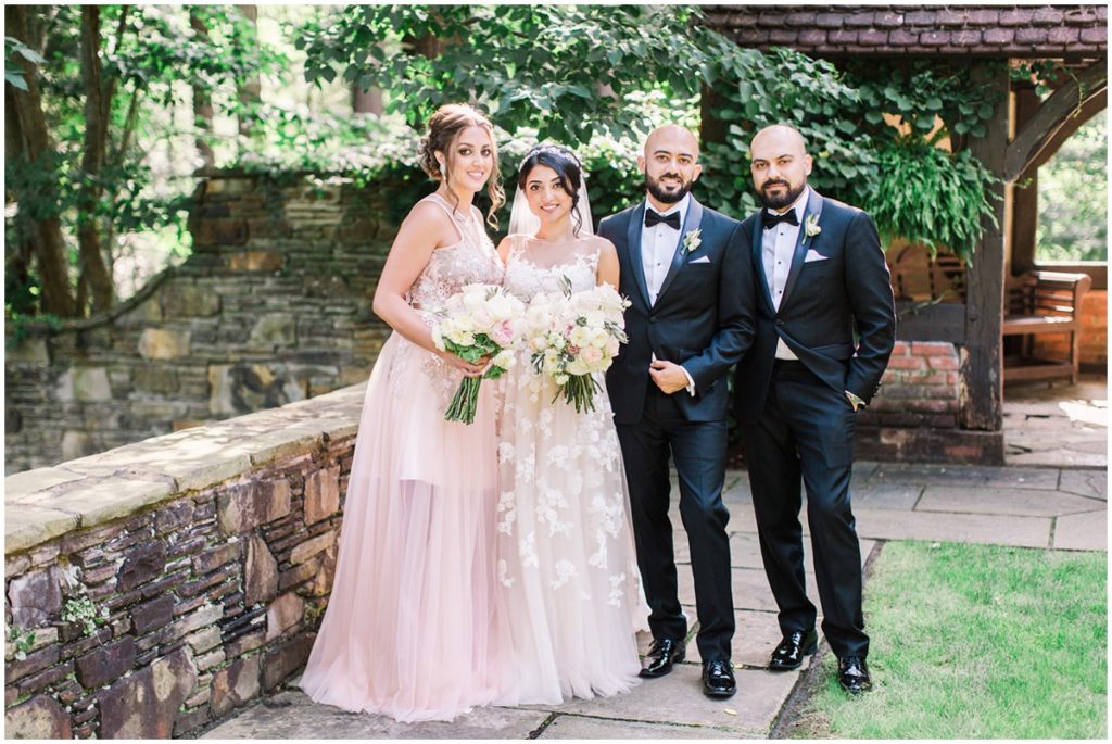 A wedding party posing for their portraits at the Club at Hillbrook