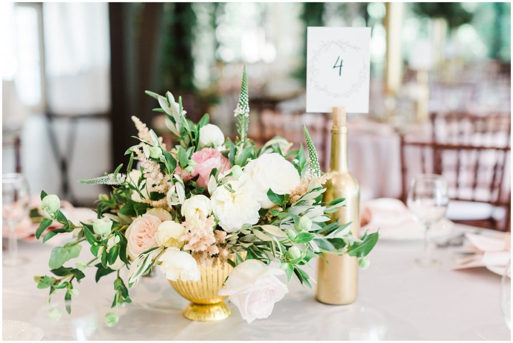 A detailed image of a floral arrangement on a table top for a wedding at the Club at Hillbrook in Chagrin Falls, Ohio.