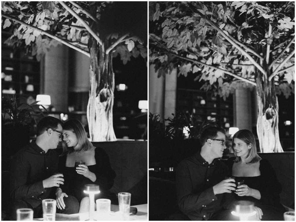 Couple posing in Bartleby and having a drink for their Cleveland Engagement Session