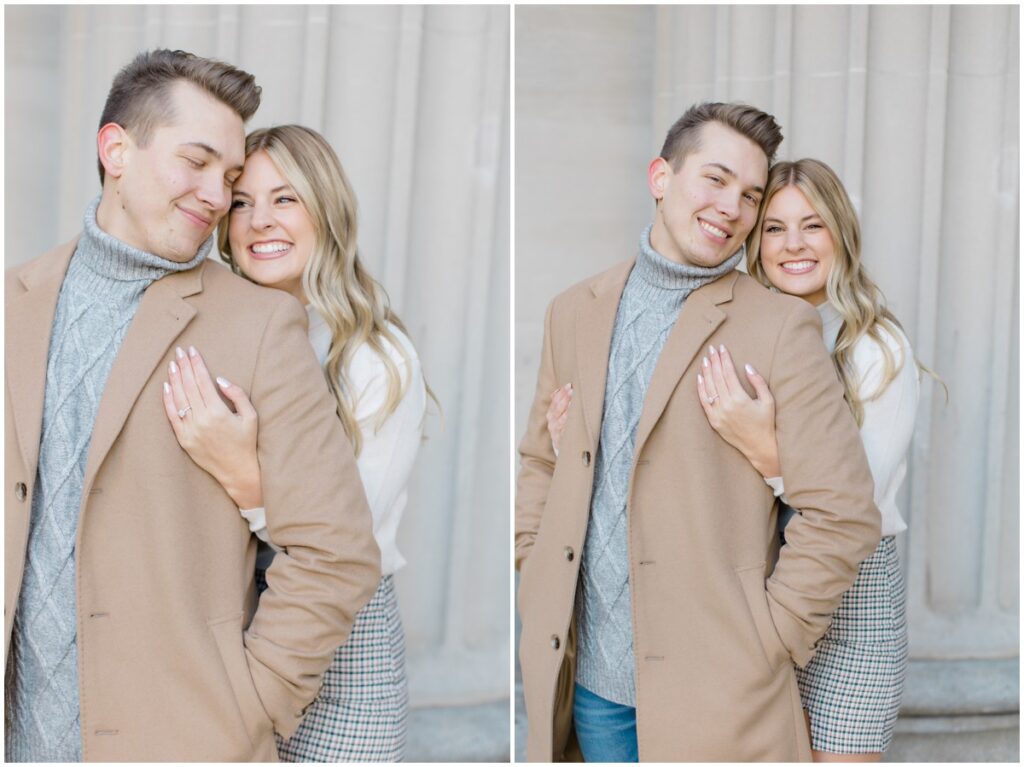 An engaged couple posing outside Terminal Tower in Cleveland Ohio for their engagement session