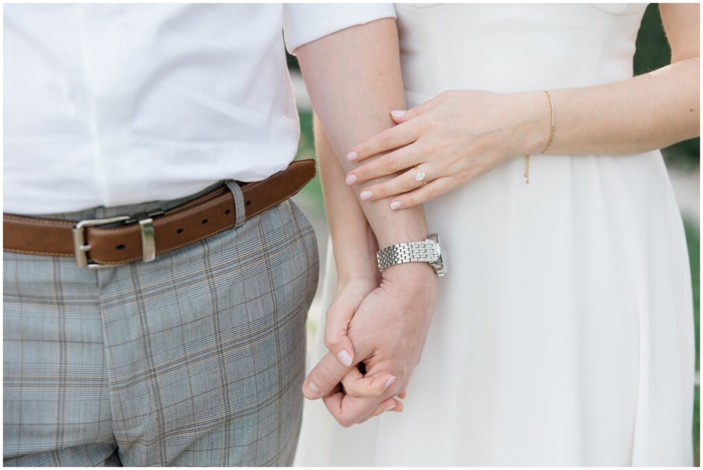 Couple holding hands during their cleveland museum of art engagement session