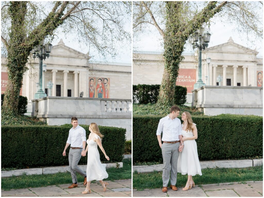 A couple walking in front of the cleveland museum of art during their engagement session