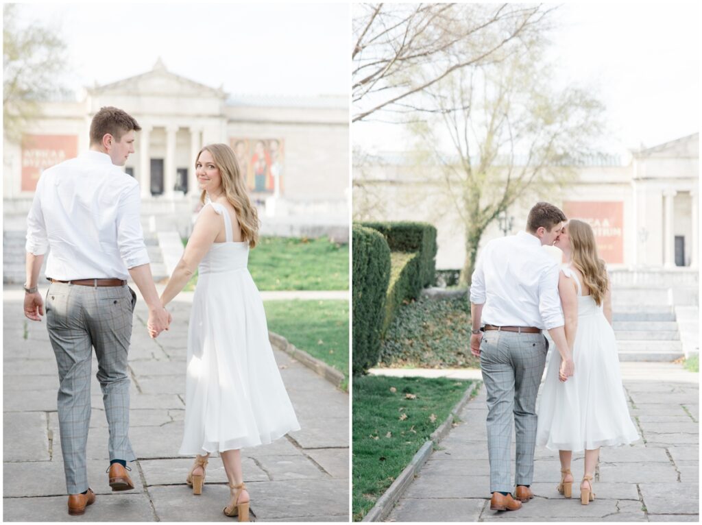 A couple walking and holding hands during their engagement session at the cleveland museum of art.