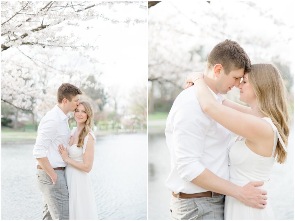 A couple looking at each other under cherry blossom trees during a spring time engagement session at the cleveland museum of art