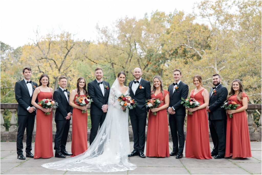 A Wedding party formal photo in the fall time.