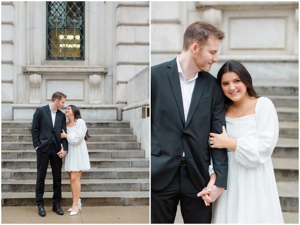 A couple embracing each other on the steps of the Cleveland Public Library during their engagement session in Cleveland, Ohio.