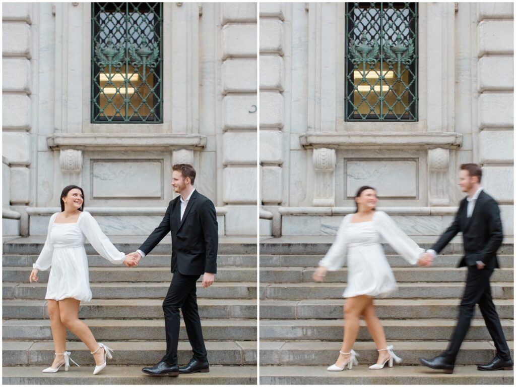 A couple holding hands and walking on the steps in front of the Cleveland Public Library during their engagement session