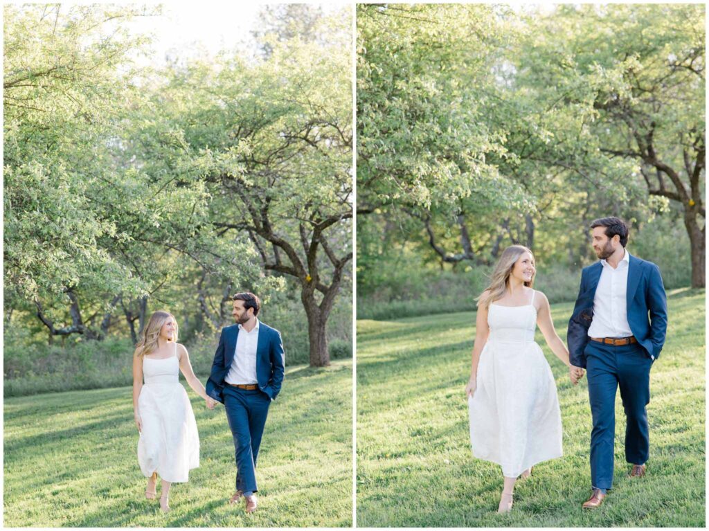 A couple walking through a field for their engagement session in Akron Ohio at Seiberling Nature Realm.
