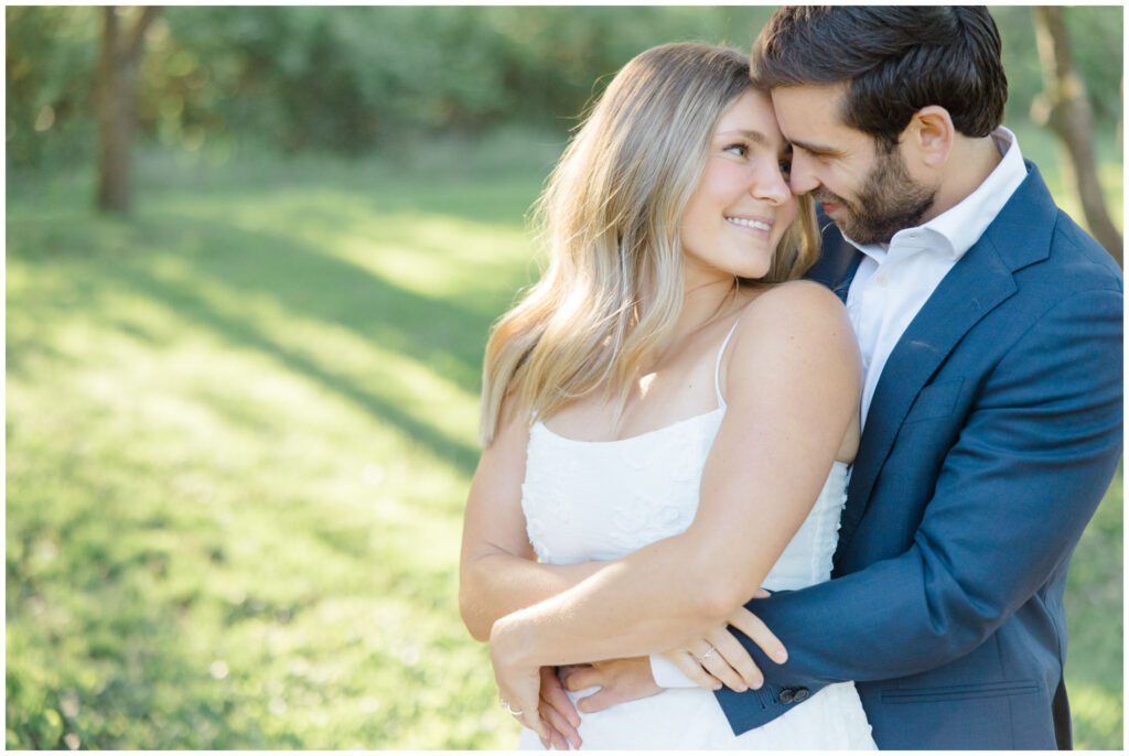 A couple posing for their engagement session in at Seiberling Nature Realm in Akron, Ohio.