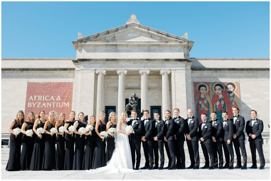 Wedding party lined up in front of the Cleveland Museum of Art