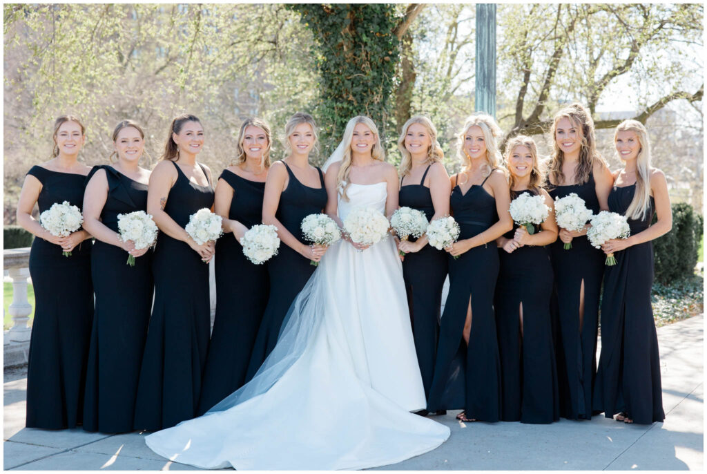 Bride and her bridesmaids posing outside the cleveland museum of art