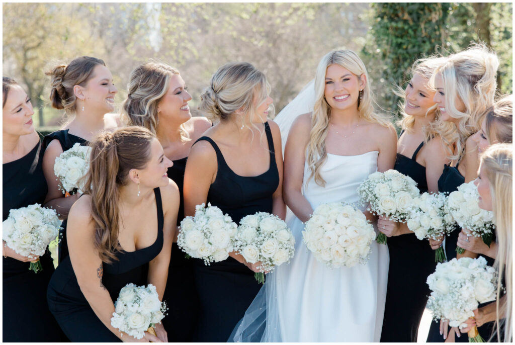 Bride and her bridesmaids posing outside the cleveland museum of art