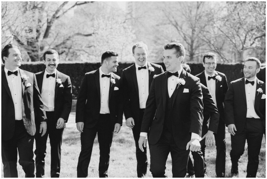 Groom walking with his groomsmen