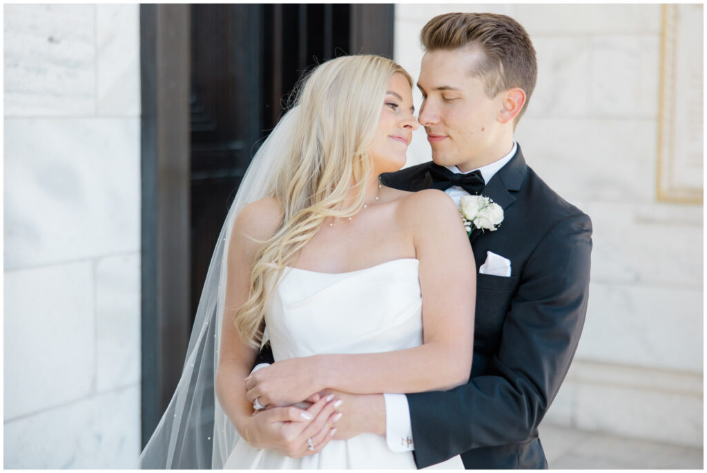 A couple posing for their wedding portraits at the Cleveland Museum of Art