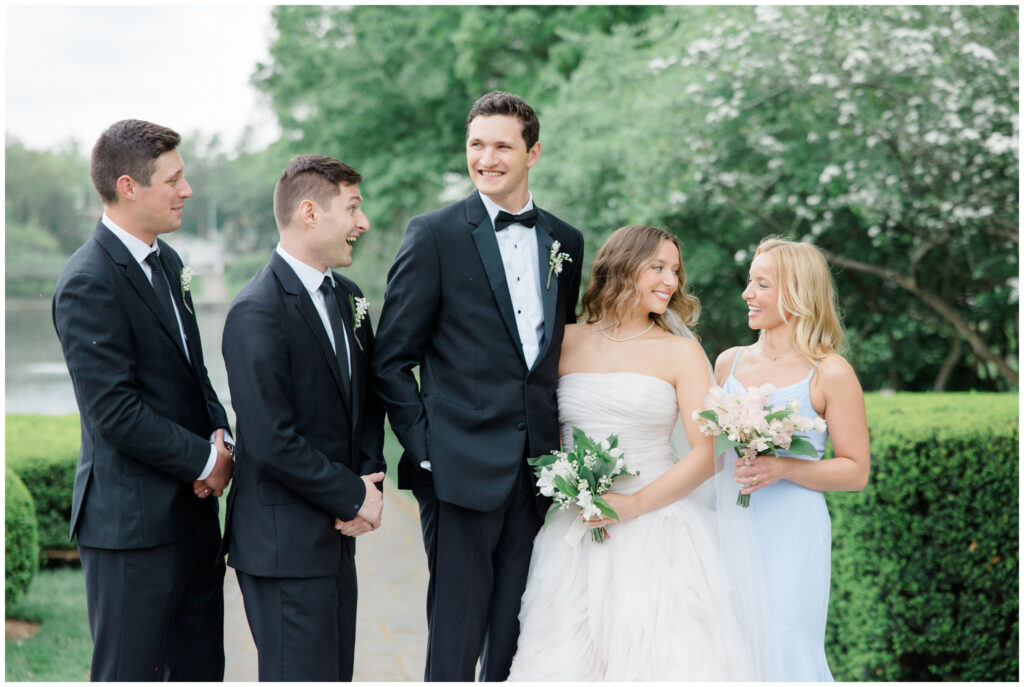 A wedding party posing for their portraits at the Cleveland Museum of Art