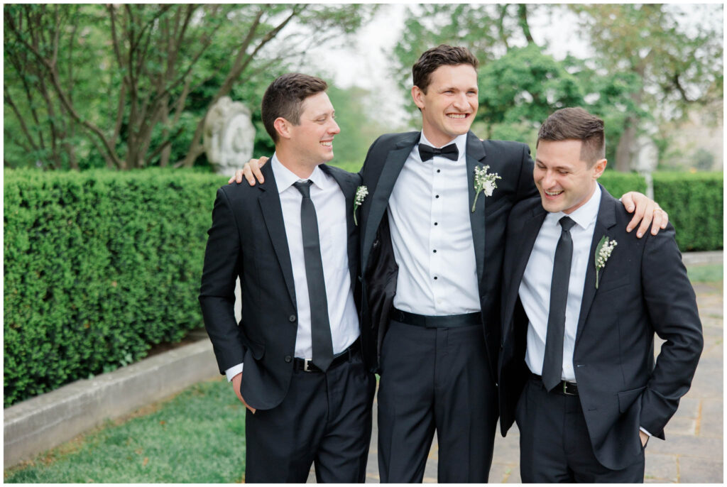 A wedding party posing for their portraits at the Cleveland Museum of Art
