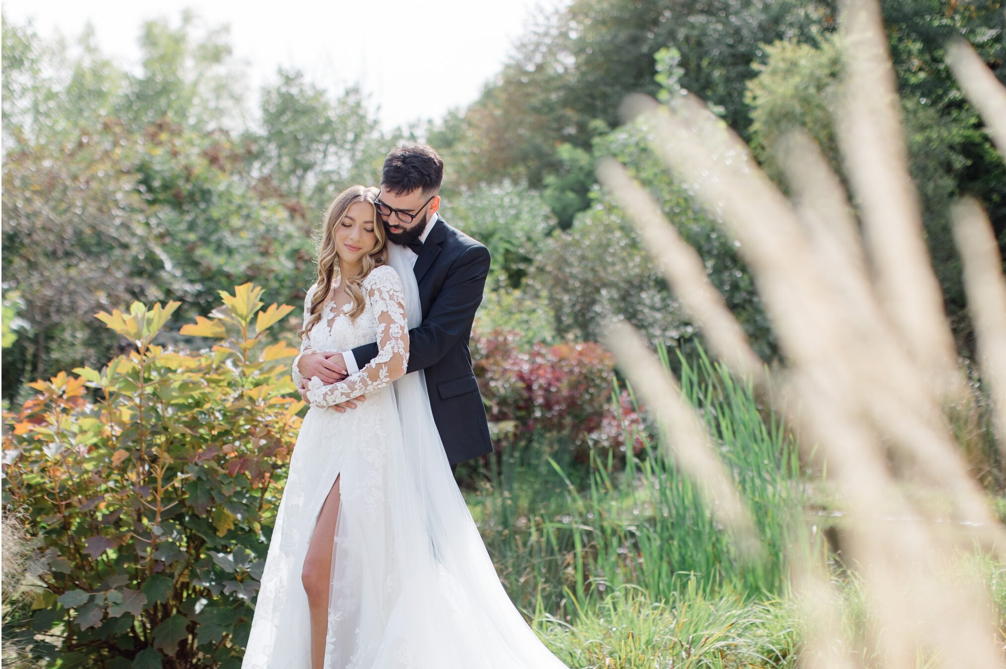 A bride and groom embracing each other for their wedding portraits at Highfields Event Center in Hudson ohio
